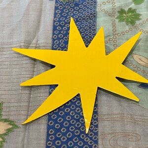 Yellow Starburst pin by jeweler Patrick Rétif (1958-1952), Paris.